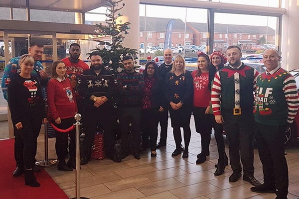 Employees in Christmas Jumpers for Save the Children.